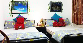 Family room at Nobel Bungalow Nuwara Eliya with double beds and teddy bears – cozy for families