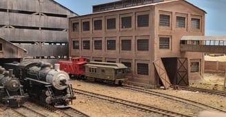 Superior Mine diorama with locomotive and mine buildings.