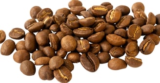 a pile of medium roasted coffee beans on a white background