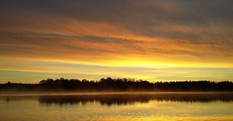 beautiful sunset in sweden. there are clouds that seem to be on fire. perfect for pike fishing  