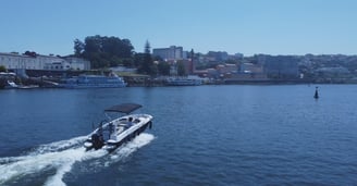 Private boat cruising on Douro River in Porto, Portugal, for scenic tours