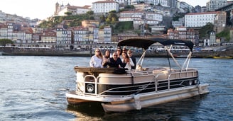 Group enjoying private pontoon boat tour on Douro River in Porto, Portugal