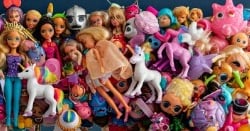 a bunch of dolls dolls and toys on display