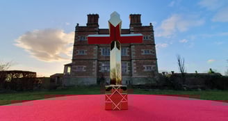 One half of the artwork 'In Hoc Signo' shown in front of Soulton Hall.