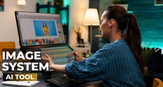 a woman sitting at a desk with a laptop computer designing images