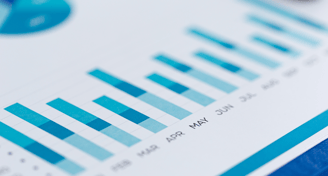 a close up of the monthly financial data of a business in bar graphs and pie charts