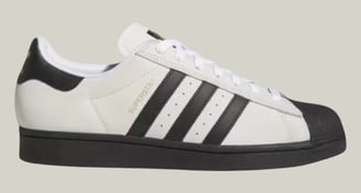 a white adidas sneakers with black and white stripes