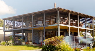 a wooden house with a deck