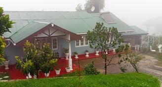 Misty morning view of Nobel Bungalow Nuwara Eliya – peaceful holiday home with garden view