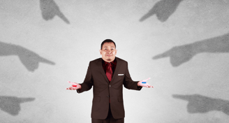 a man in a suit and tie is holding a red pill and a blue pill