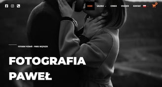 a man and woman kissing in front of a camera