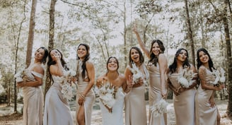 happy bride and bridal party because they hired a great wedding coordinator