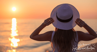 a woman in a white dress and hat