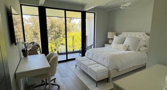 a bedroom with a bed and a desk