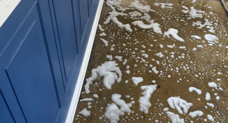 a floor with a lot of soap foam on it