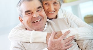 elderly couple smiling