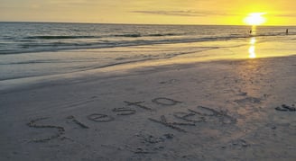 photo of the words Siesta Key written in the sand on Siesta Key