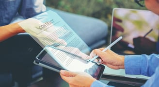 a man signing a contract