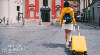 a woman walking down a cobblestone street