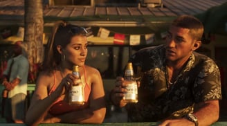 a man and woman sitting at a table with beer