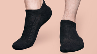 a man in a black ankle sock