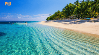 a boat is parked on the beach in Fiji