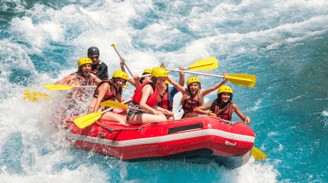 a group of people rafting down a river
