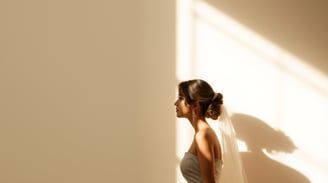 a bride in a wedding dress standing in front of a wall