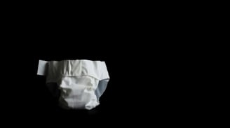 a baby's diaper on a black background