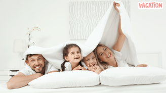 a family of four people are smiling and having fun