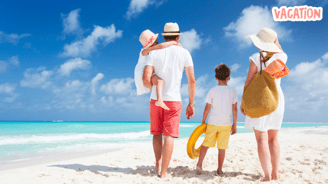 a family of four standing on a beach