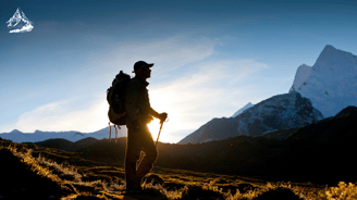 a man with a backpack on a mountain
