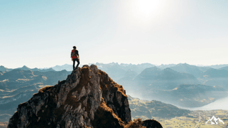 a person standing on a mountain top