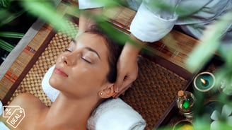 a woman getting a massage at a spa