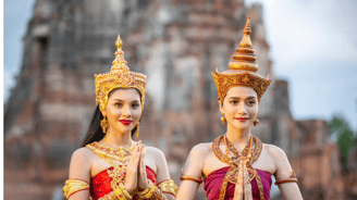 two women in traditional thai costumes