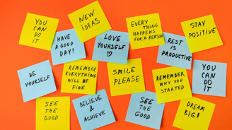 a bunch of sticky notes with words on them