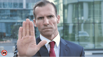 a man in a suit and tie is holding his hand up to the camera