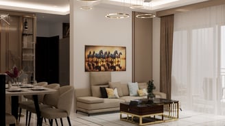 Lounge area with a premium sofa set, coffee table & lit with a modern chandelier