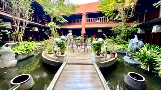 a wooden walkway leading to a wooden deck