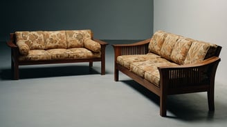 two wooden couches in a room