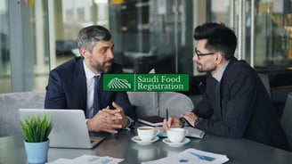 Experts reviewing SFDA food compliance documents with Arabic labels during a regulatory consultation in Saudi Arabia.