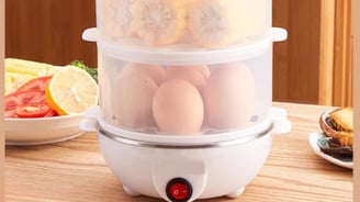 Cozedor elétrico multifuncional, ideal para cozinhar ovos de forma rápida e prática.
