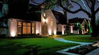 landscape lighting on front facade of house, tree up lighting and moon lighting