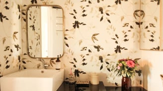 bathroom remodel with floral wallpaper and modern sink basin