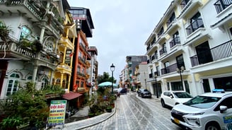 a street scene with a car parked on the side of the road