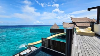 ozen reserve bolifushi overwater villa slide