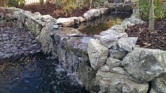 Natural rockery stone waterfall pond in hickling, norfolk