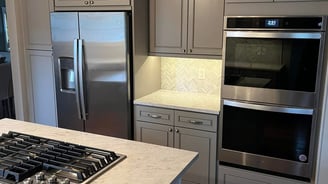 a kitchen with a stove top oven and a stove top oven