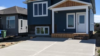 blue siding home with cedar and stone accents
