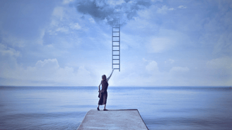 person reaching for a staircase leading to the sky
